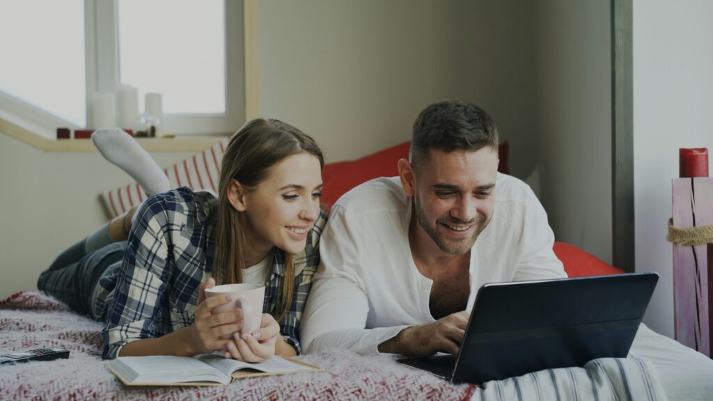 couple looking at a laptop together
