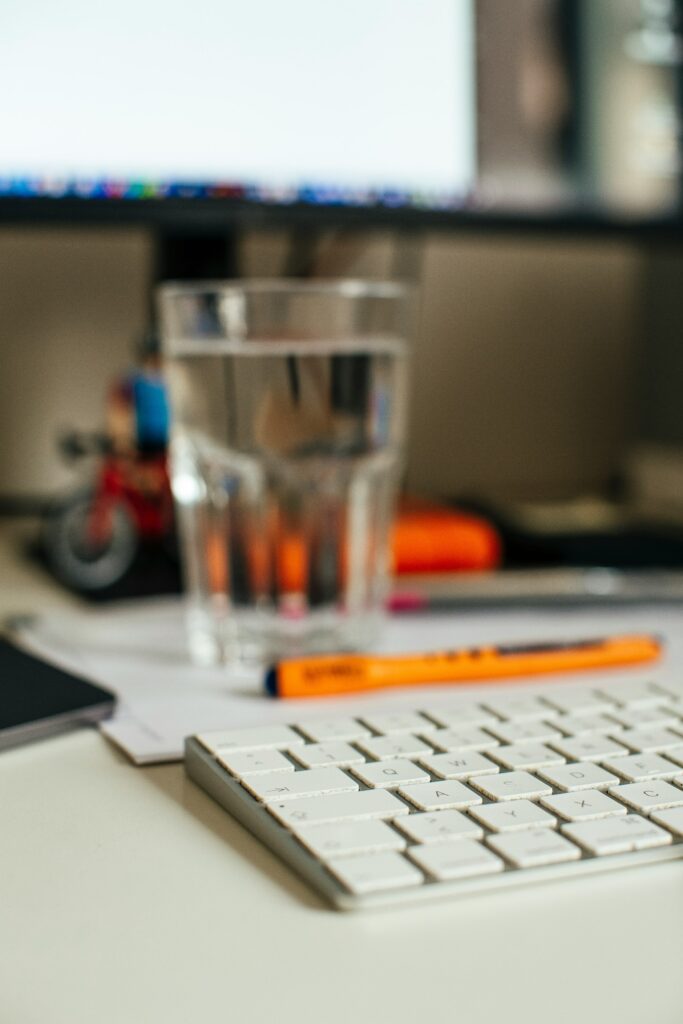 Glass of water sitting on a desk