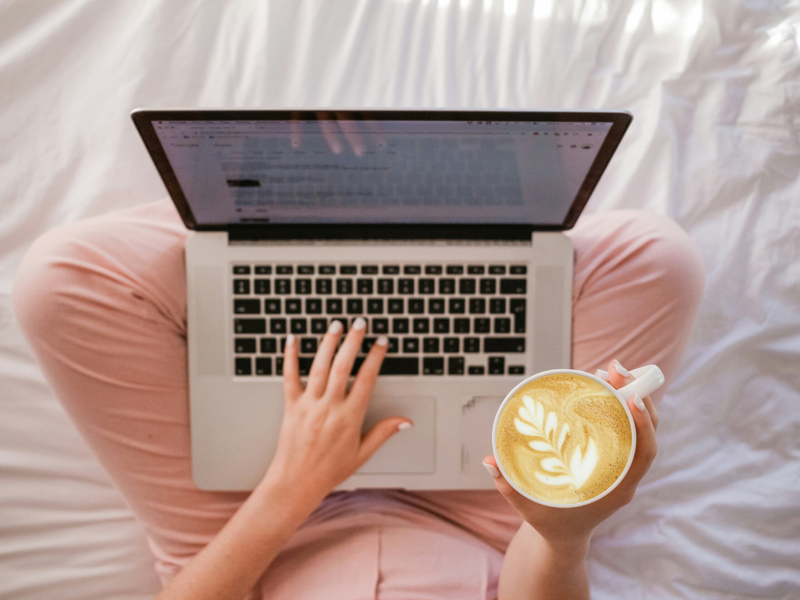 freelancer writing on a laptop
