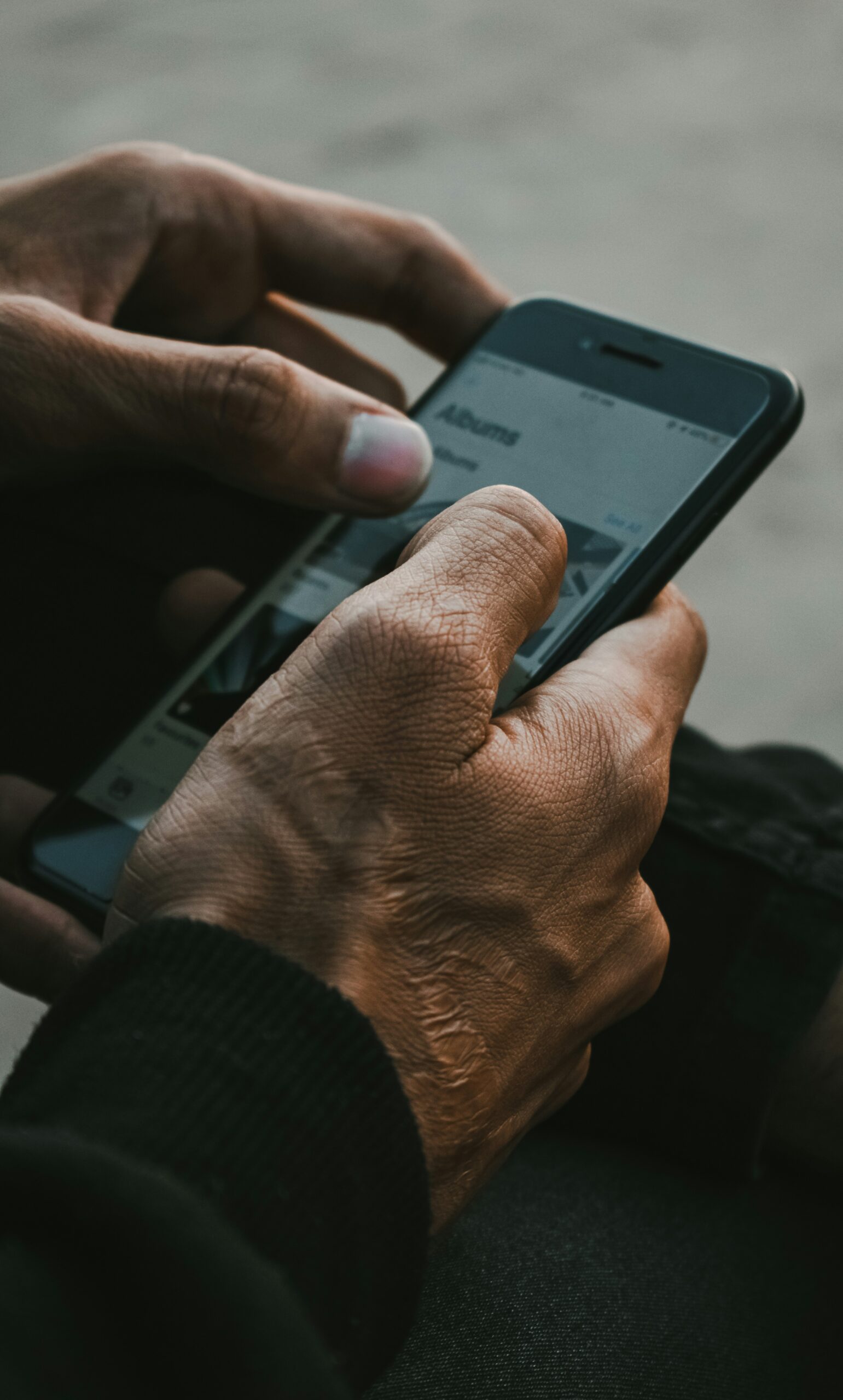 Reviewing photos closely to check for signs of AI generation