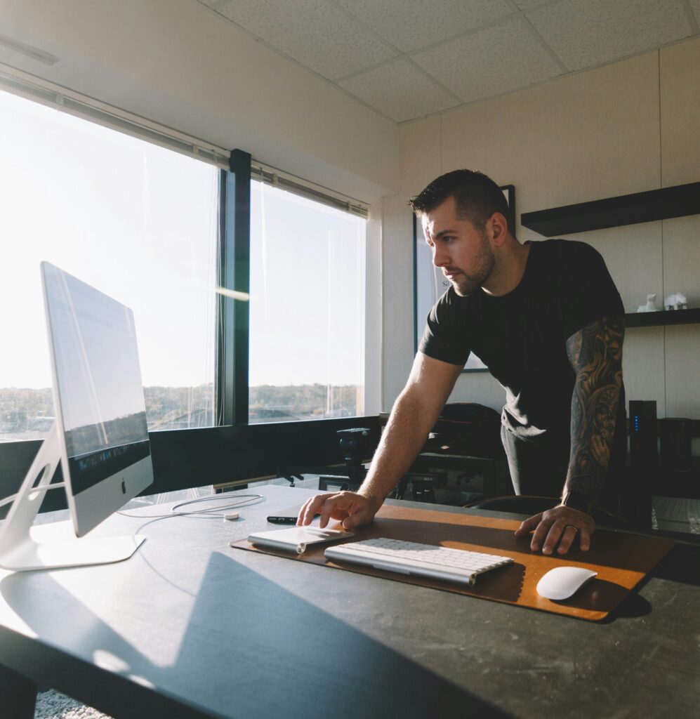 Man working at a desktop computer in an office
