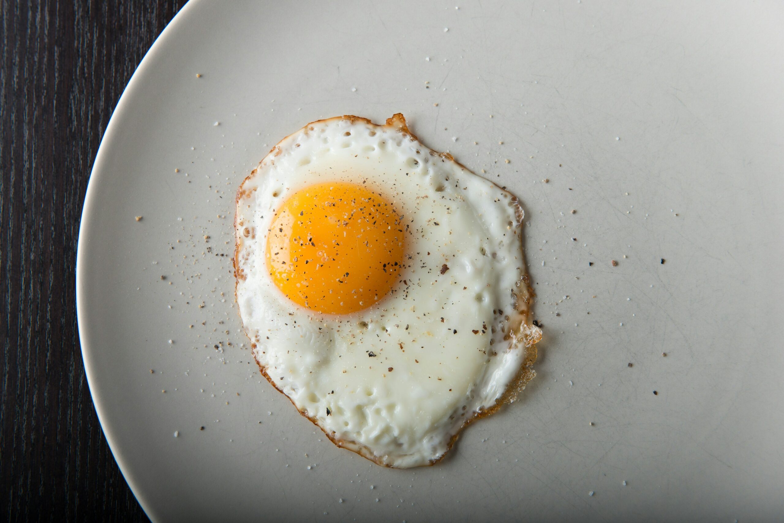 Simple fried egg on a plate