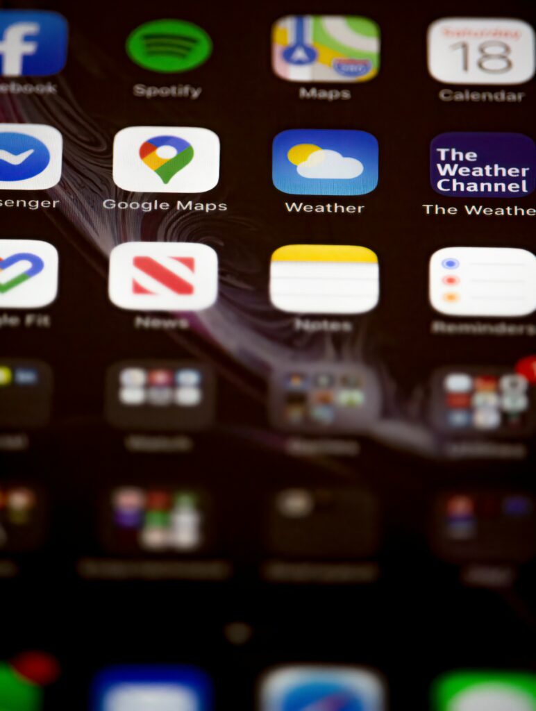 Close-up of a tablet home screen showing everyday app icons