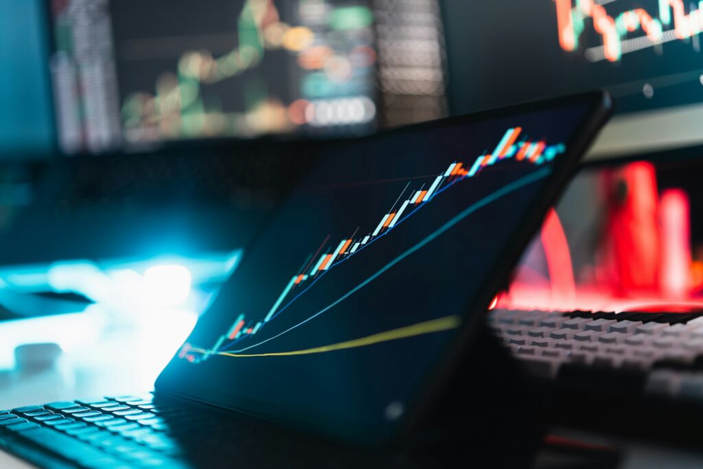 hand holding tablet showing a stock market chart
