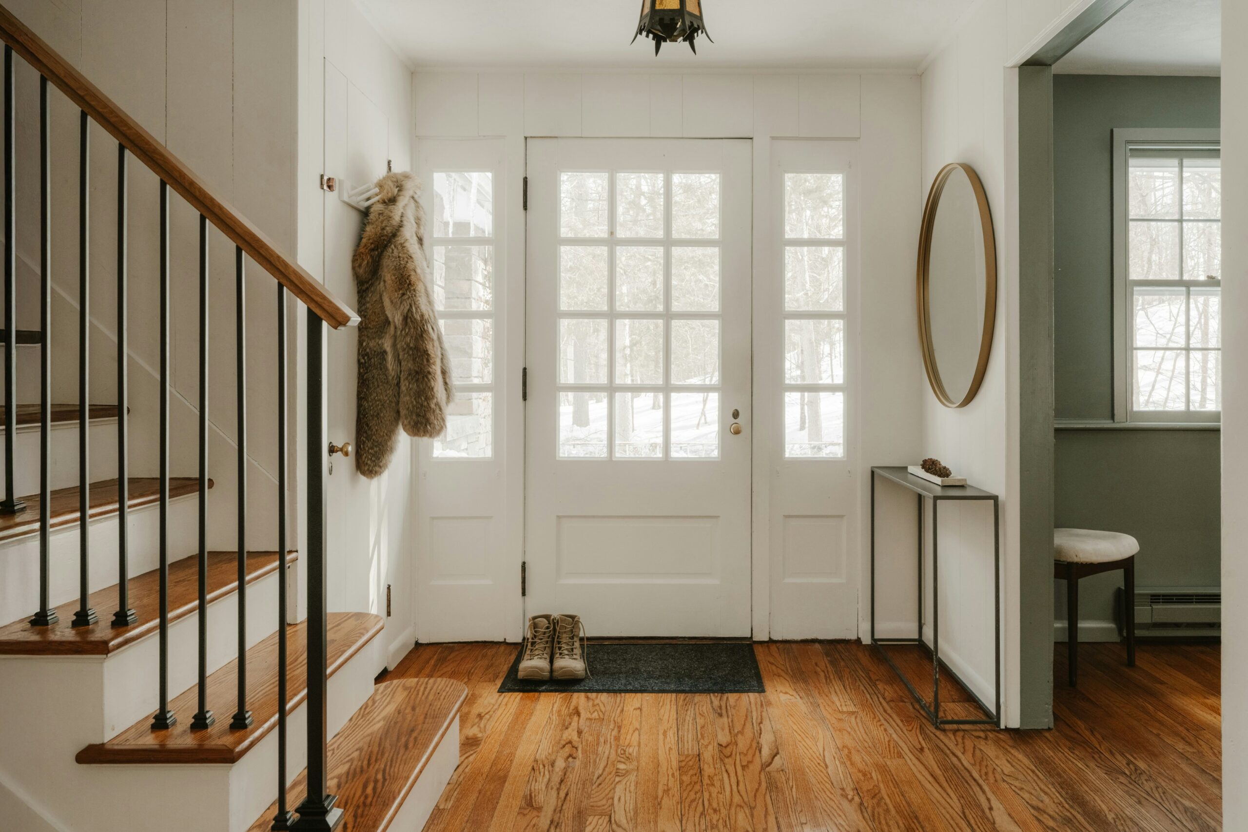 Pair of walking shoes placed by the front door