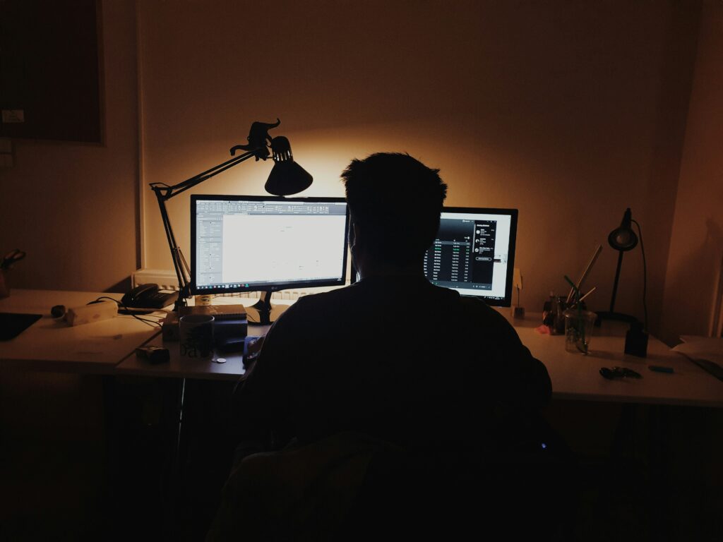 Person sitting at a desk working on a computer